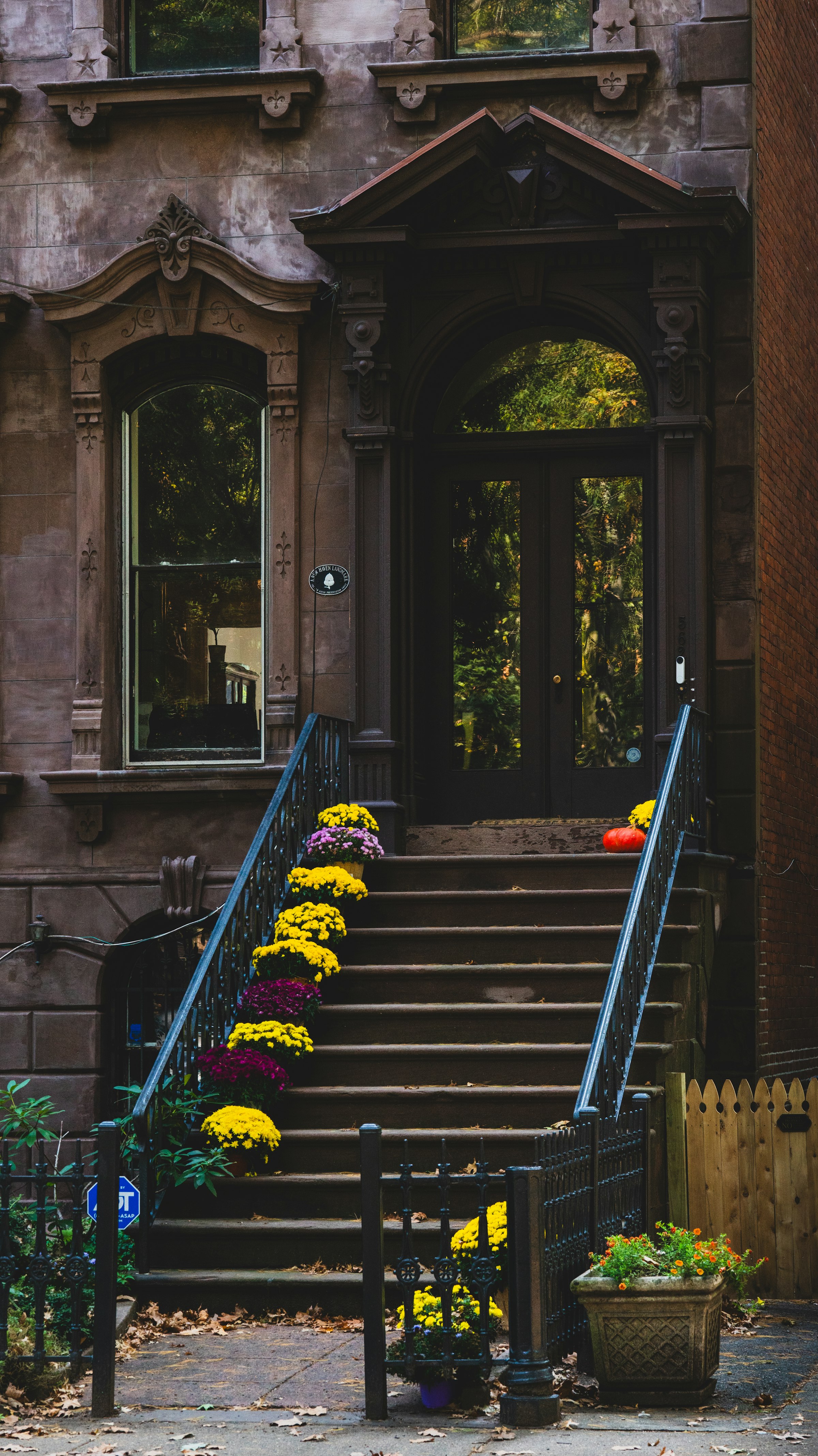 Elegant historic stone residence entrance with flowers, evoking Gold Coast limestone architecture